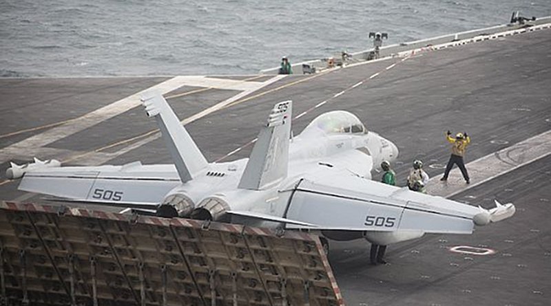 An E/A-18 Growler from the "Patriots" of Electronic Attack Squadron (VAQ) 140 readies to launch from the flight deck of the Nimitz-class aircraft carrier USS Abraham Lincoln (CVN 72), June 16, 2019, in the Arabian Sea. The Abraham Lincoln Carrier Strike Group is deployed to the U.S. 5th Fleet area of operations in support of naval operations to ensure maritime stability and security in the Central Region, connecting the Mediterranean and the Pacific through the western Indian Ocean and three strategic choke points. With Abraham Lincoln as the flagship, deployed strike group assets include staffs, ships and aircraft of Carrier Strike Group (CSG) 12, Destroyer Squadron (DESRON) 2, the guided-missile cruiser USS Leyte Gulf (CG 55) and Carrier Air Wing (CVW) 7. (U.S. Navy photo by Mass Communication Specialist Seaman Apprentice Stephanie Contreras/Released)