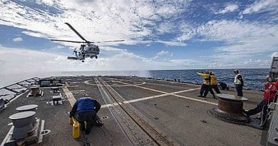An MH-60R Sea Hawk helicopter assigned to the Saberhawks of Helicopter Maritime Strike Squadron (HSM) 77 lands on the flight deck aboard the Arleigh Burke-class guided-missile destroyer USS McCampbell (DDG 85). McCampbell is forward-deployed to the U.S. 7th Fleet area of operations in support of security and stability in the Indo-Pacific region. (U.S. Navy photo by Mass Communication Specialist 3rd Class Isaac Maxwell/Released)