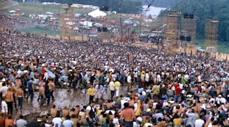 Woodstock festival site with the stage. Photo Credit: Derek Redmond and Paul Campbell, Wikipedia Commons.