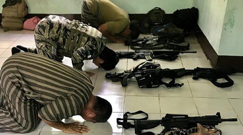 Moro Islamic Liberation Front fighters bow in prayer at a mosque inside Camp Darapanan, Philippines. Photo Credit: Jason Gutierrez / BenarNews