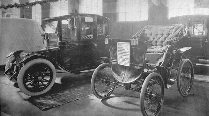 An electric vehicle and an antique car on display at a 1912 auto show in Toronto, Canada. Credit: William James. Source: Wikimedia Commons.