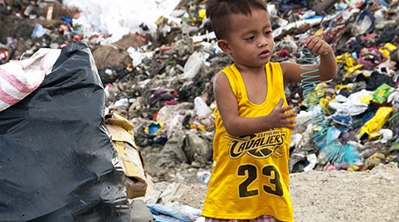 File photo of a child in a garbage dump in the Philippines.