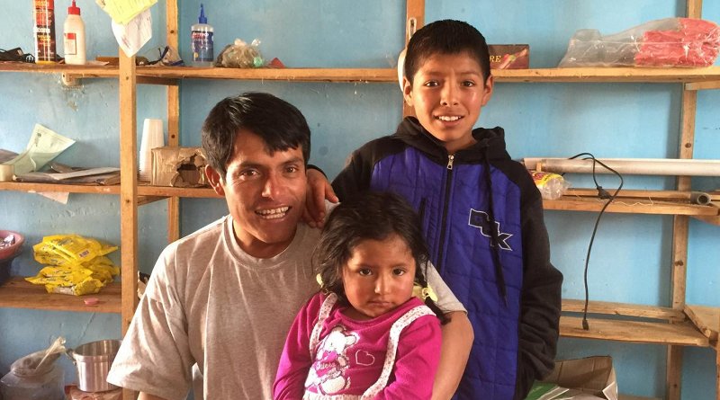 A village official and his children in Copa, Peru, a community that's adapting to changing water levels due to retreating glaciers. Credit Ben Orlove