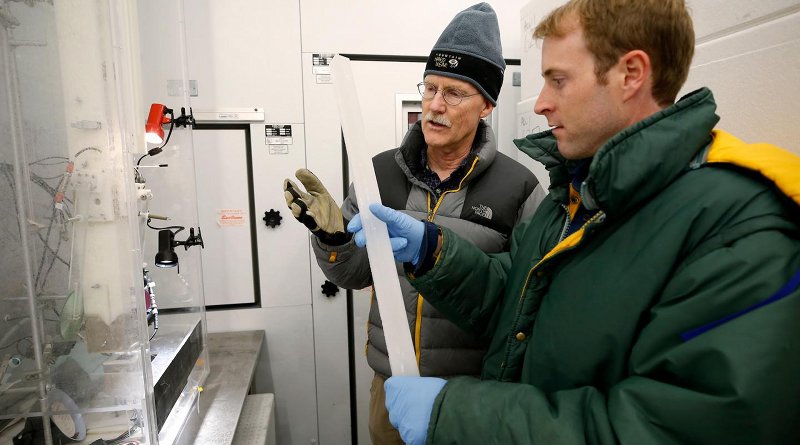 Joe McConnell, Ph.D, the study's lead author, and Nathan Chellman, a doctoral student at DRI and coauthor on the study, examine an ice core in DRI's Ultra-Trace Ice Core Chemistry Laboratory in Reno, Nevada. Credit DRI