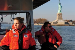 U.S. Coast Guard petty officers conducting a pollution assessment in the wake of Hurricane Sandy, 11 November 2012