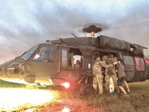 Army Reserve aviators work with civilian volunteers to airlift elderly survivors from Hurricane Harvey to safety, 30 August 2017.
