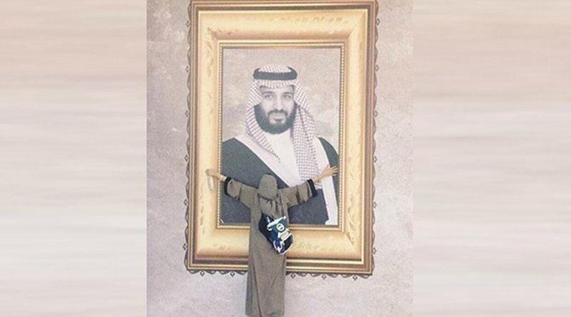 The viral picture showing Munira Abdullah hugging a giant portrait of Crown Prince Mohammed bin Salman. (Supplied photo)