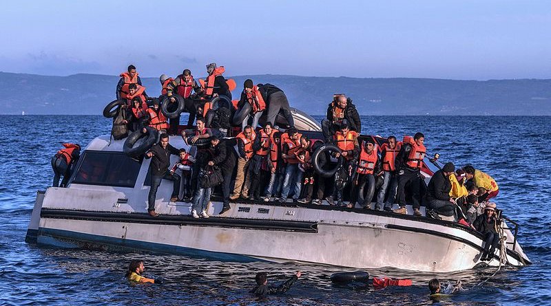 File photo of Proactiva Open Arms helping Syrian and Iraqi refugees in Lesbos, October 2015. Photo Credit: Ggia, Wikipedia Commons.