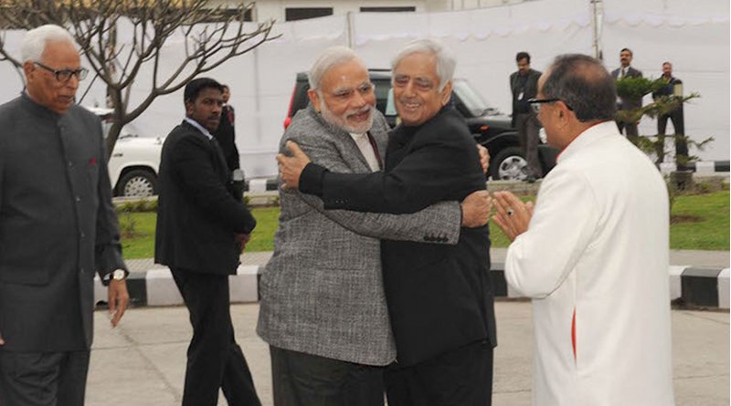 Prime Minister Narendra Modi arrives at the swearing-in ceremony of Mufti Mohammad Sayeed as Jammu&Kashmir Chief Minister, at Jammu University, in Jammu and Kashmir on March 1, 2015. The J&K Governor N.N. Vohra is also seen. Credit: India Prime Minister's Office.