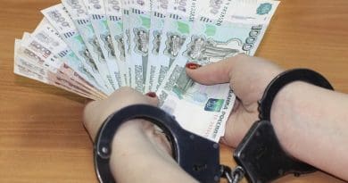 corruption bribe money currency handcuffs