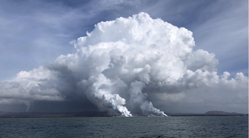 Kilauea lava entry site on the southeast coastline of Hawaii. Billowing plumes of laze caused by the interaction of hot molten lava and seawater are visible. Credit Karin Bjorkman, UH.