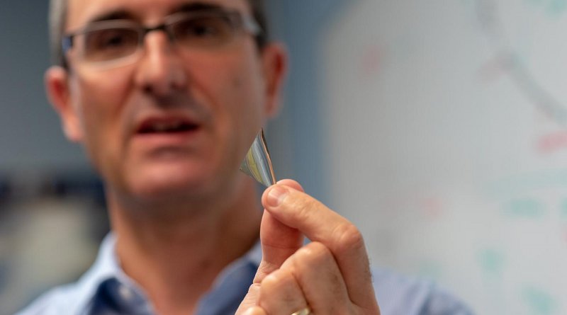 University of Vermont scientist Frederic Sansoz holds a sliver of the world's strongest silver. The new form of metal is part of a discovery that could launch technological advances from lighter airplanes to better solar panels. Credit Joshua Brown