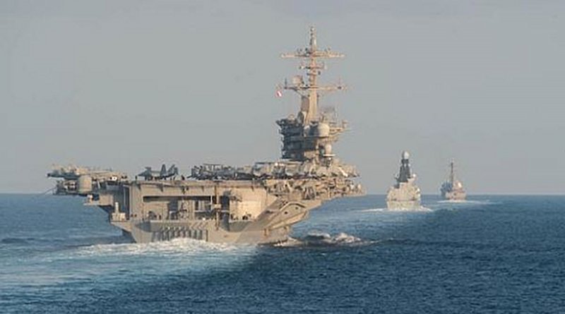 The aircraft carrier USS Abraham Lincoln (CVN 72), left, the Royal Navy air defense destroyer HMS Defender (D 36) and the guided-missile destroyer USS Farragut (DDG 99) transit the Strait of Hormuz. (U.S. Navy photo by Mass Communication Specialist 3rd Class Zachary Pearson/Released)