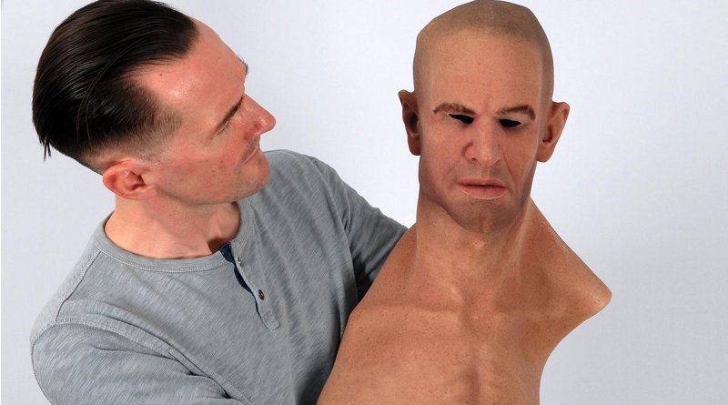 Dr. Rob Jenkins holds a hyper-realistic mask. CREDIT University of York