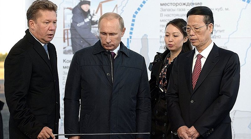 Russian President Vladimir Putin with Chairman of Gazprom’s Management Committee Alexei Miller (left) and Vice Premier of China Zhang Gaoli before the ceremony to mark the joining of the first section of the Power of Siberia mainline gas pipeline. Photo Credit: Kremlin.ru