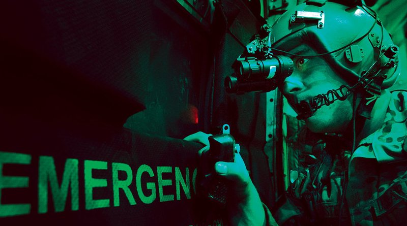 In 2013, A U.S. Air Force loadmaster scans for threats using night vision goggle aboard a C-130 aircraft after completing a cargo drop over Ghazni, province in Afghanistan. (U.S. Air Force/ Ben Bloker)