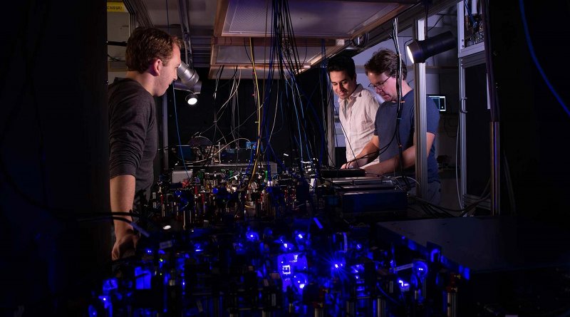 Adam Shaw, Ivaylo Madjarov and Manuel Endres work on their laser-based apparatus at Caltech. CREDIT Caltech