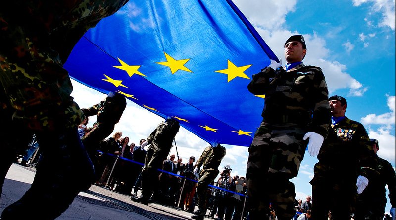 Soldiers carrying the EU flag. Photo Credit: European Union 2014 - European Parliament, Flickr