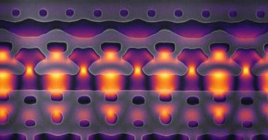 This image, magnified 25,000 times, shows a section of a prototype accelerator-on-a-chip. The segment shown here are one-tenth the width of a human. The oddly shaped gray structures are nanometer-sized features carved in to silicon that focus bursts of infrared laser light, shown in yellow and purple, on a flow of electrons through the center channel. As the electrons travel from left to right, the light focused in the channel is carefully synchronized with passing particles to move them forward at greater and greater velocities. By packing 1,000 of these acceleration channels onto an inch-sized chip, Stanford researchers hope to create an electron beam that moves at 94 percent of the speed of light, and to use this energized particle flow for research and medical applications. CREDIT Image courtesy of Neil Sapra