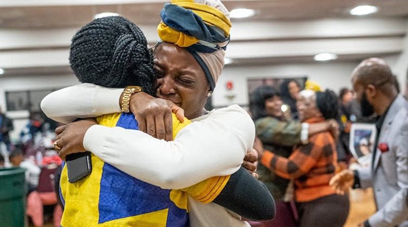 Denise Butler (right) embraced Nelima Sitati Munene on January 4 in Brooklyn Park as they celebrated a new federal law giving Liberians in the U.S. a path to citizenship. Credit: Evan Frost | MPR News