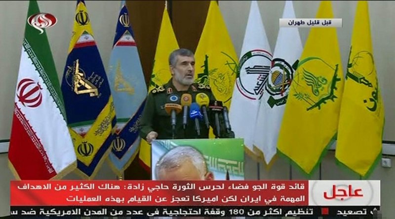 Gen. Amir Ali Hajizadeh in front of a range of Iranian proxy flags alongside official Iranian flags on state TV. (Screengrab)