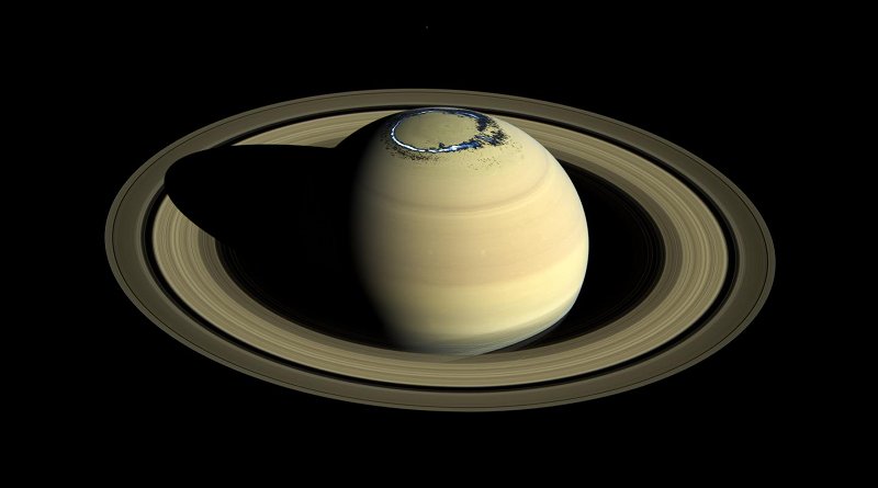 Composite of a true colour image of Saturn, observed by Cassini in 2016, overlaid with a false colour representation of the ultraviolet aurora in the northern hemisphere as observed on 20 August 2017. CREDIT NASA/JPL-Caltech/Space Science Institute/A. Bader (Lancaster University).