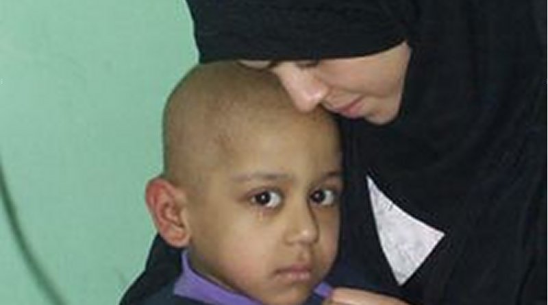 Cathy Breen, March 2003: Adra and her 5-year-old son Atarid in hospital. Atarid suffered from cancer. He died on the third day of the the United States' Shock and Awe bombing.