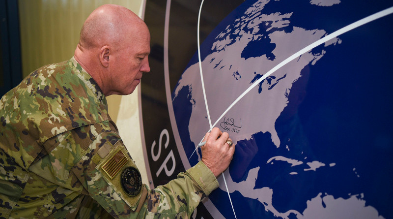 Space Force Gen. John W. “Jay” Raymond, chief of space operations, signs the U.S. Space Command sign in the Perimeter Acquisition Radar building at Cavalier Air Force Station, N.D., Jan. 10, 2020. Photo Credit: Air Force Senior Airman Melody Howley