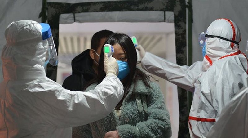 Body temperature being checked at the exit of a railway station in Fuyang, Anhui province, China, January 29, 2020. Credit: AN Ming/EPA