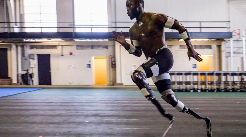 Blake Leeper, a double-below-the-knee amputee vying for the 2020 Olympics, sprints on the indoor track at CU Boulder. CREDIT Glenn Asakawa/CU Boulder