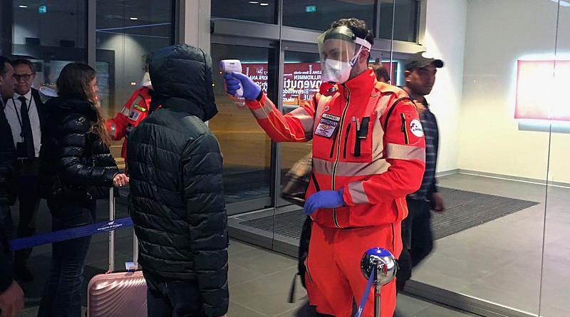 Civil Protection volunteers carrying out health checks at the Guglielmo Marconi Airport in Bologna, Italy. Photo Credit: Dipartimento Protezione Civile, Wikipedia Commons