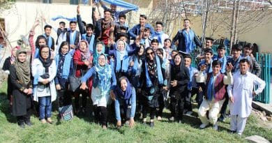 The Afghan Peace Volunteers wearing blue scarves symbolising their belief that “all humans live under the same blue sky”