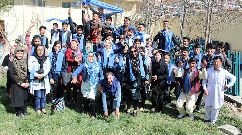 The Afghan Peace Volunteers wearing blue scarves symbolising their belief that “all humans live under the same blue sky”
