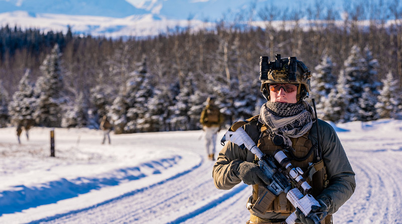 A reconnaissance team member with 1st Reconnaissance Battalion, 1st Marine Division, patrols the area during tactical recovery of personnel training at Fort Greely, Alaska, Feb. 24, 2020. Photo Credit: Marine Corps Sgt. Conner Downey