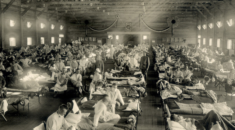 Soldiers from Fort Riley, Kansas, ill with Spanish flu at a hospital ward at Camp Funston. Photo Credit: Otis Historical Archives, National Museum of Health and Medicine, Wikipedia Commons