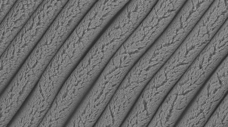 These forest-like rows of carbon nanotubes were created on an elastomer substrate that was pre-stretched in one direction and then allowed to contract. This process creates stretchable supercapacitors that hold more charge in less space and remain functional even when stretched to eight times their original size. CREDIT Changyong Cao, Michigan State University