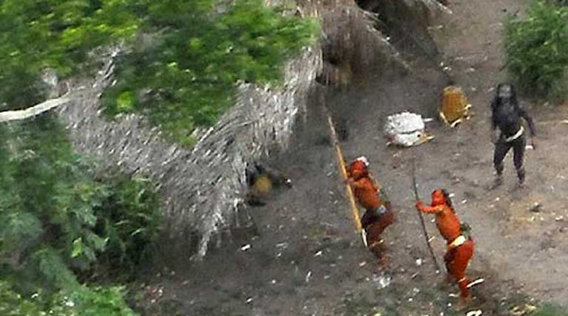 This uncontacted indigenous group in the Brazilian Amazon is clearly hostile to the helicopter hovering overhead. Photo credit: TravelingMan on VisualHunt / CC BY-NC-ND.