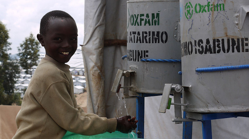 Child washing hands. Photo Credit: Laura Eldon/Oxfam, (CC BY 2.0). This photo has been cropped. (https://www.flickr.com/photos/oxfameastafrica/8073670225/sizes/l/)