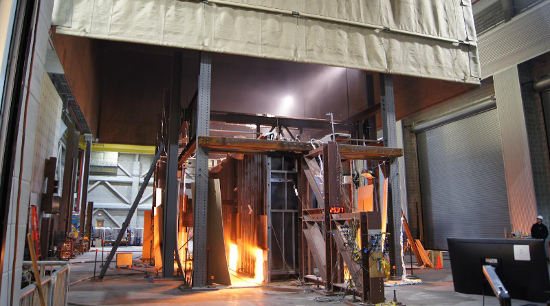Inside a fireproof compartment, NIST researchers subjected full-scale replicas of office building floors to fires produced by three gas-fueled burners. CREDIT NIST