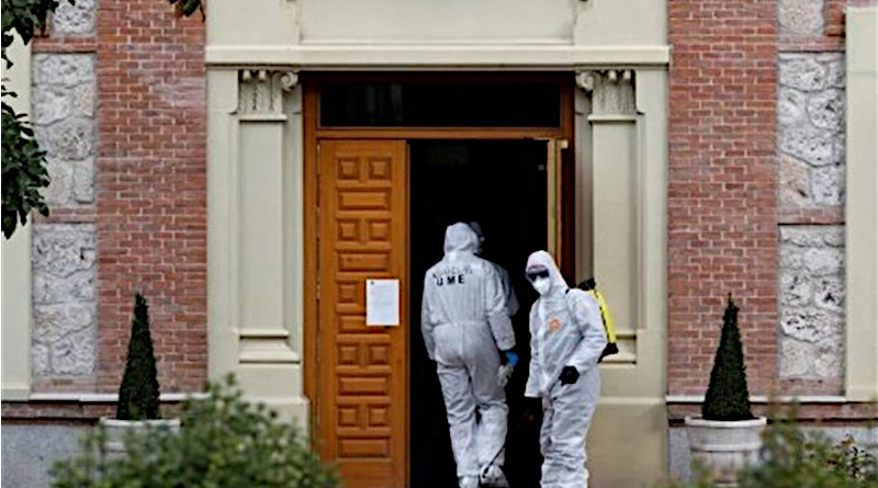 Workers disinfecting a building in fight against coronavirus in Spain. Photo Credit: Tasnim News Agency