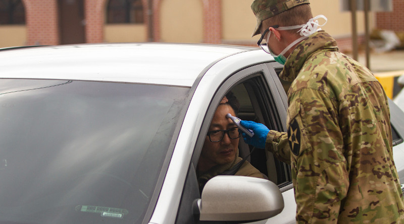 Soldiers stationed on U.S. Army Garrison Casey conduct pre-screening coronavirus processes on people waiting to enter the post, USAG-Casey, Dongducheon, South Korea, Feb. 26, 2020. Photo Credit: Army Sgt. Amber Smith
