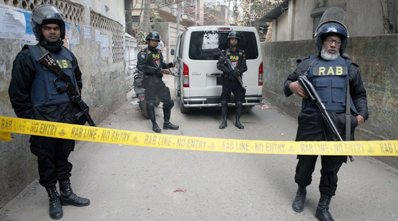 File photo of members of Bangladesh’s Rapid Action Battalion cordon off a suspected militant hideout in Dhaka. BenarNews