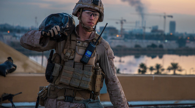Marine with 2nd Battalion, 7th Marines, carries sandbag to strengthen security post during reinforcement of U.S. Embassy Compound in Baghdad, January 4, 2020 (U.S. Marine Corps/Kyle C. Talbot)