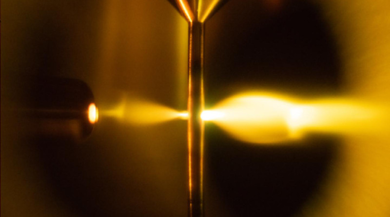 The photograph is taken during the high-harmonic-generation process in the high-pressure gas cell, with the mid-?infrared input arriving on the right and the soft x-?ray output appearing on the left. CREDIT ETH Zurich/D-PHYS Keller group