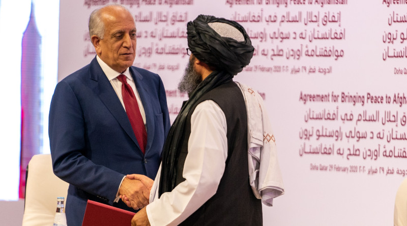 US Special Representative for Afghanistan Reconciliation Zalmay Khalilzad and Taliban co-founder Mullah Abdul Ghani Baradar shake hands after signing a landmark peace agreement in ceremony at Qatari capital Doha on February 29, 2020. Photo Credit: State Department photo by Ron Przysucha/ Public Domain