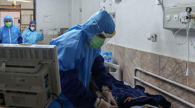 Health workers in Iran treat a coronavirus victim. Photo Credit: Iran News Wire