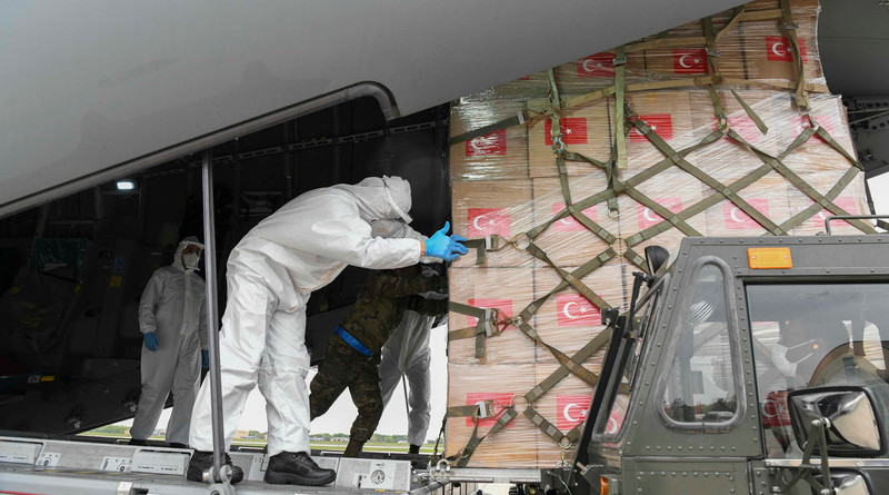 Turkish and U.S. Air Force crew members work together to unload medical supplies from a Turkish Airbus A400M Atlas at Joint Base Andrews, Md., April. 28, 2020. The Turkish aircraft landed at Andrews with medical supplies to respond to the coronavirus pandemic as a gesture of support from one NATO ally to another. Photo Credit: Air Force Airman 1st Class Spencer Slocum