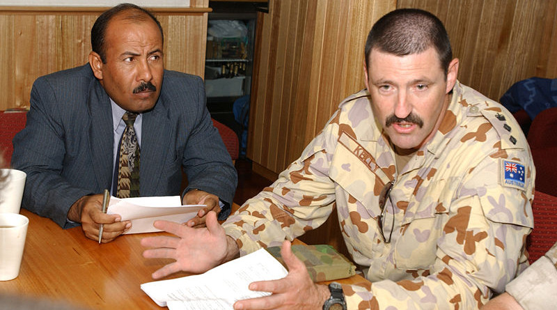 Colonel Mike Kelly (right) during his deployment to Iraq in 2003. Photo Credit: U.S. Navy photo by Journalist 2nd Class Denny Lester