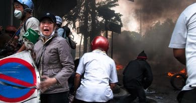 Rescue workers try to reach two wounded men under army fire, 15 May 2010. Photo Credit: Takeaway, Wikipedia Commons