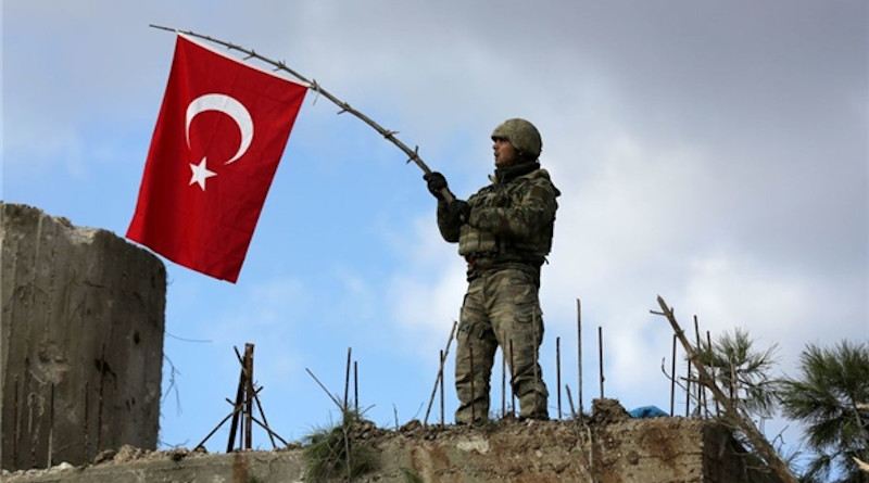Soldier waves Turkish flag in Libya. Photo Credit: Fars News Agency